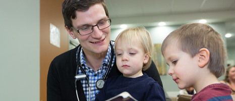 Doctors working with children.